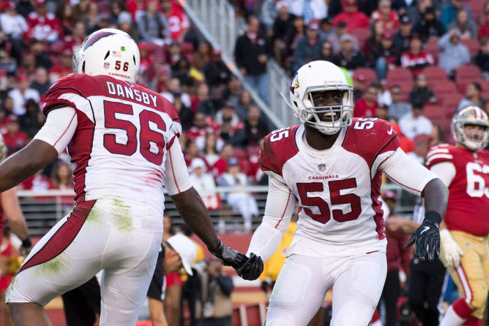 Cardinals outside linebacker Chandler Jones (55) is congratulated by inside linebacker Karlos Dansby (56) for a defensive stop against the 49ers during the fourth quarter at Levi's Stadium, Nov. 5, 2017.